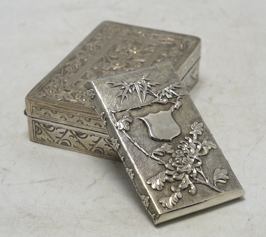 An early 20th century Chinese Export white metal card case by Wang Hing, 84mm, together with a Chinese white metal box with hinged cover. Condition - fair to good